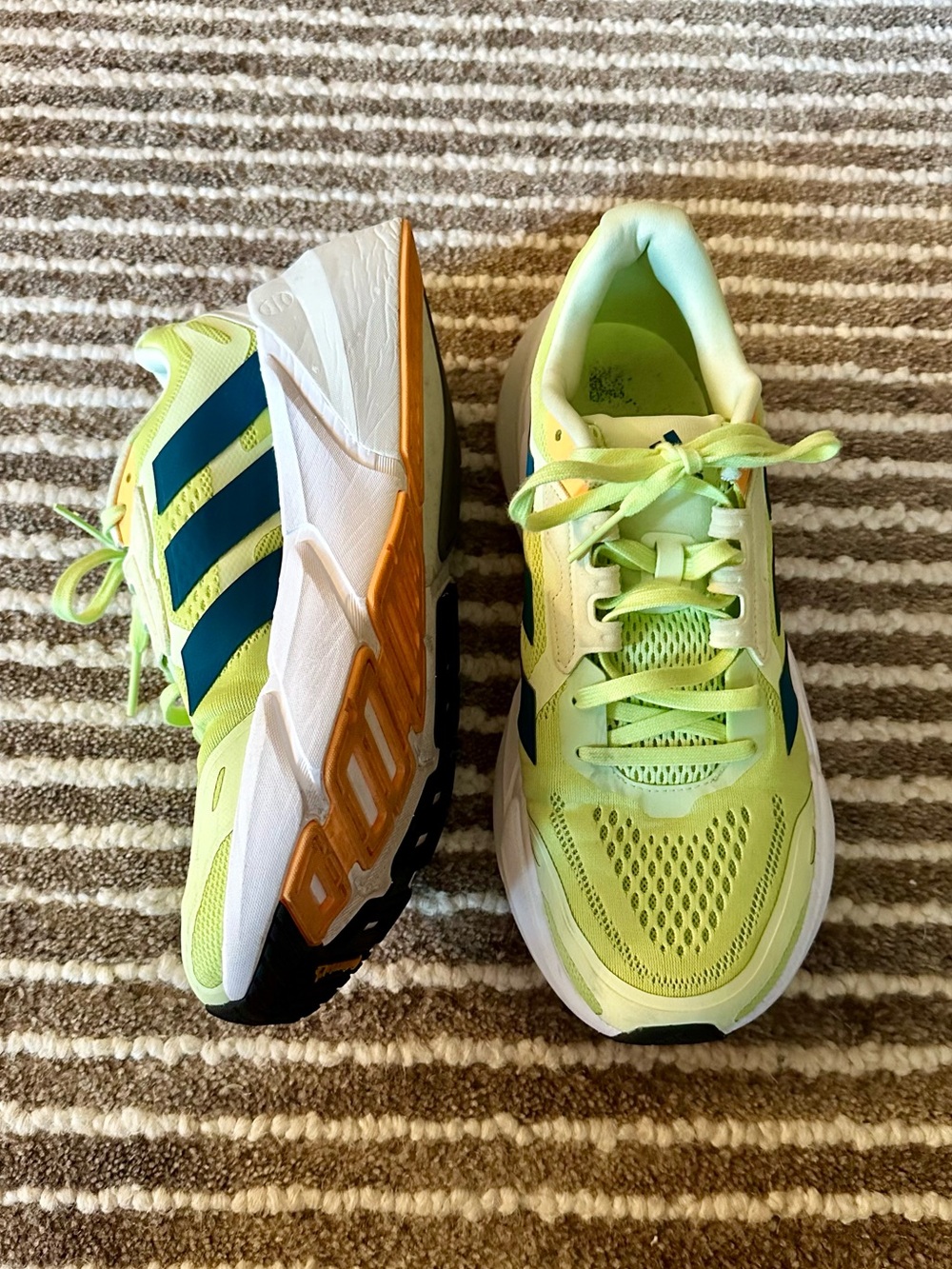 Adidas Adistar running shoes in the "Pulse Lime" and "Real Teal" colorway
